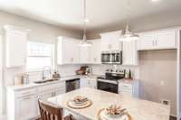 The bright white cabinets set the tone for a comfortable and inviting home.