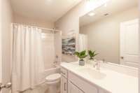 The guest bath is a nice size and bright white as well.