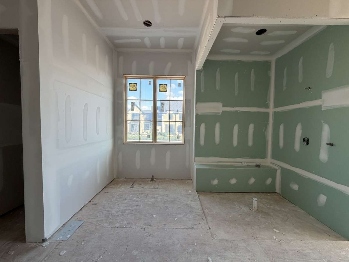 Primary Bath with free-standing tub and walk-in shower.
*This home is under construction. Photo updated 3/31/26.