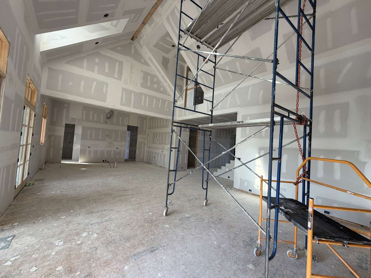 Warm vaulted Great Room connecting to Dining and Kitchen.
*This home is under construction. Photo updated 3/31/26.