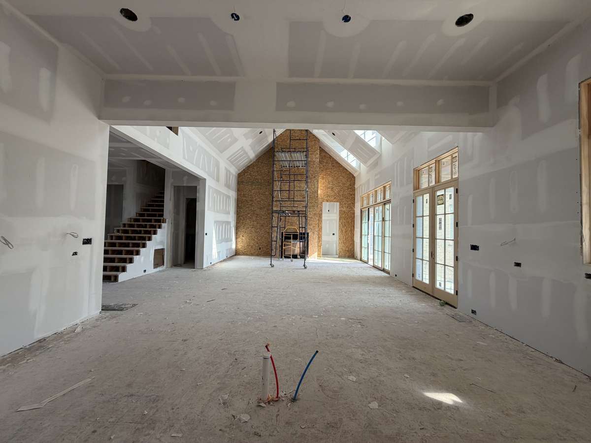 View of Kitchen and Dining Room, which open to the vaulted Great Room.
*This home is under construction. Photo updated 3/31/26.