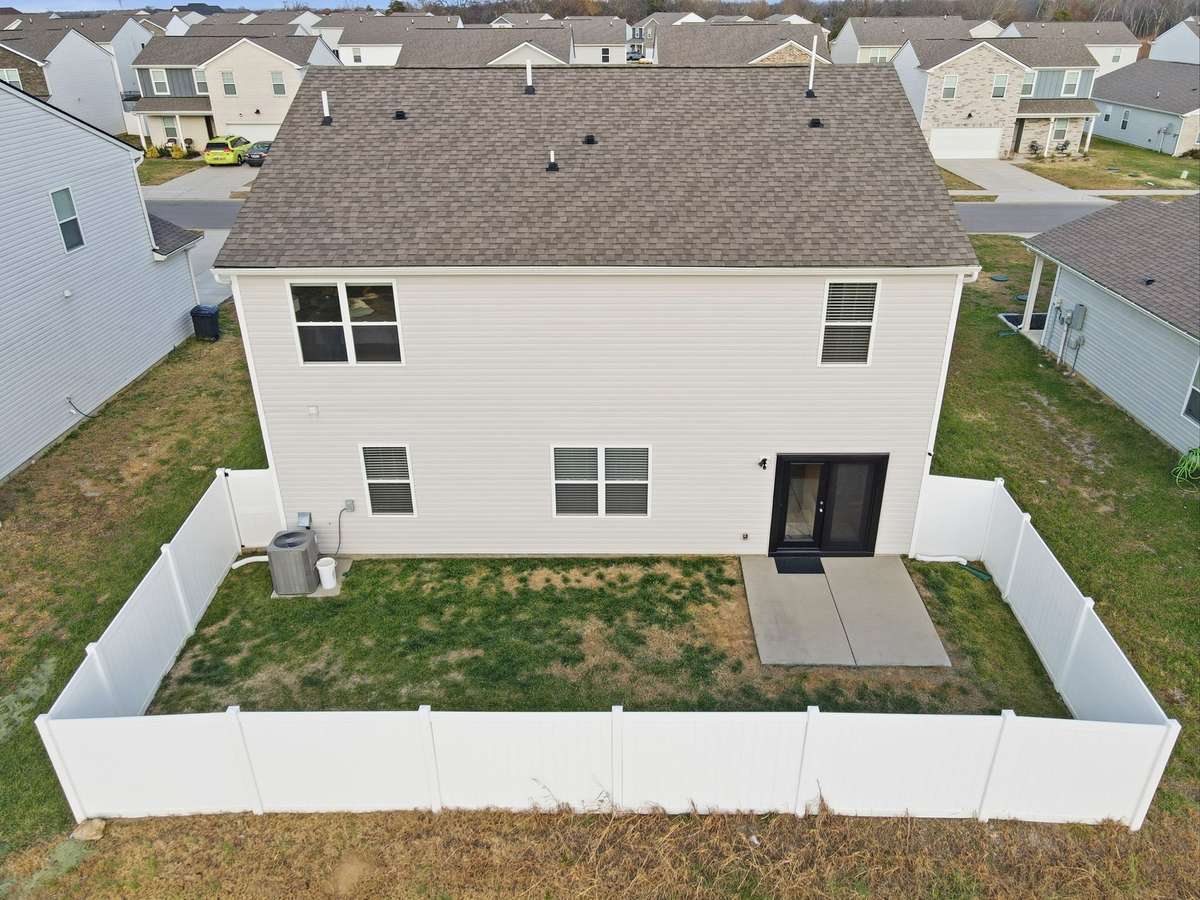 Privacy fenced backyard overlooking field - no rear neighbors!