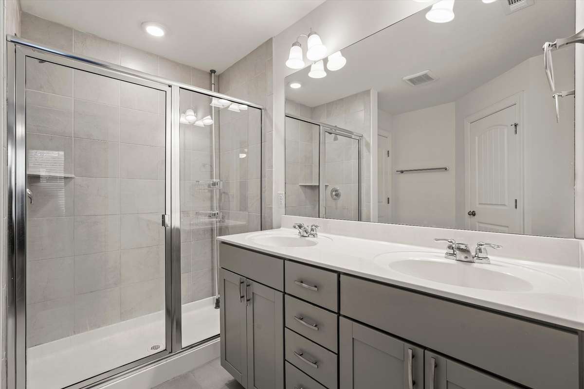 Main bathroom suite with double vanities