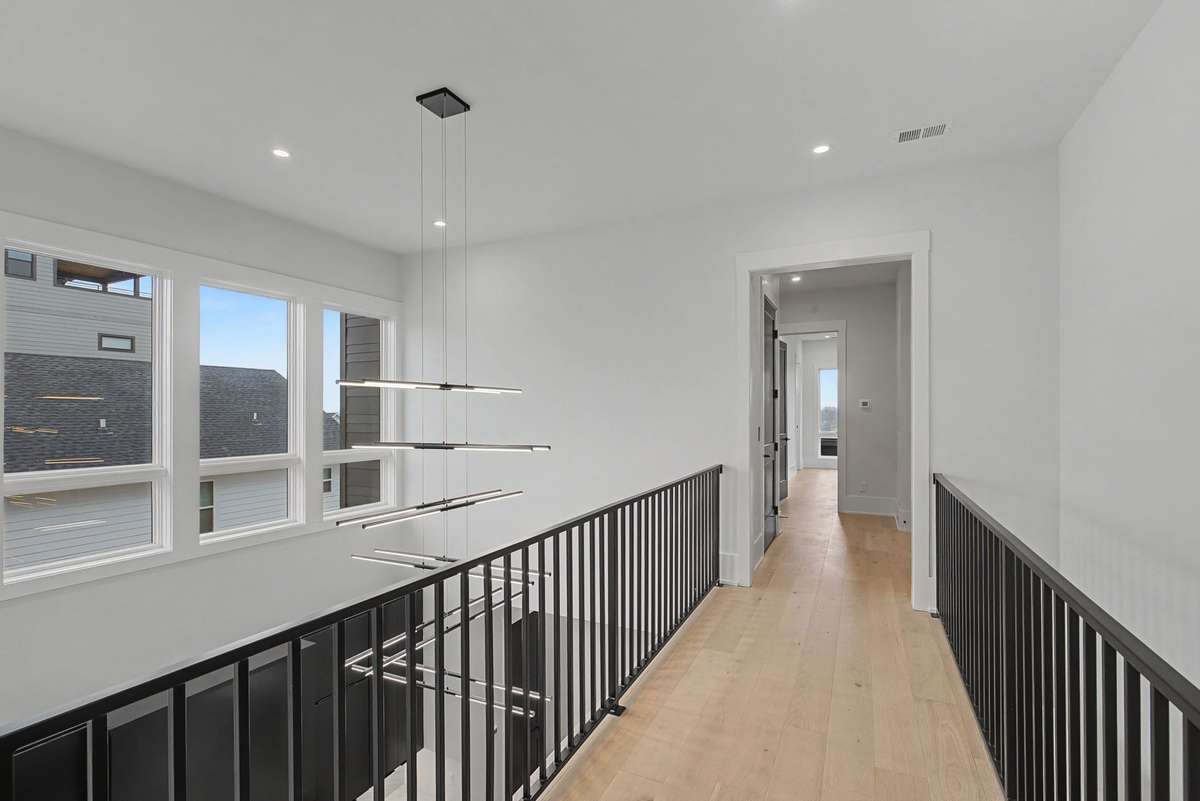Cat walk above kitchen area....tons of natural light from windows above the kitchen cabinets.