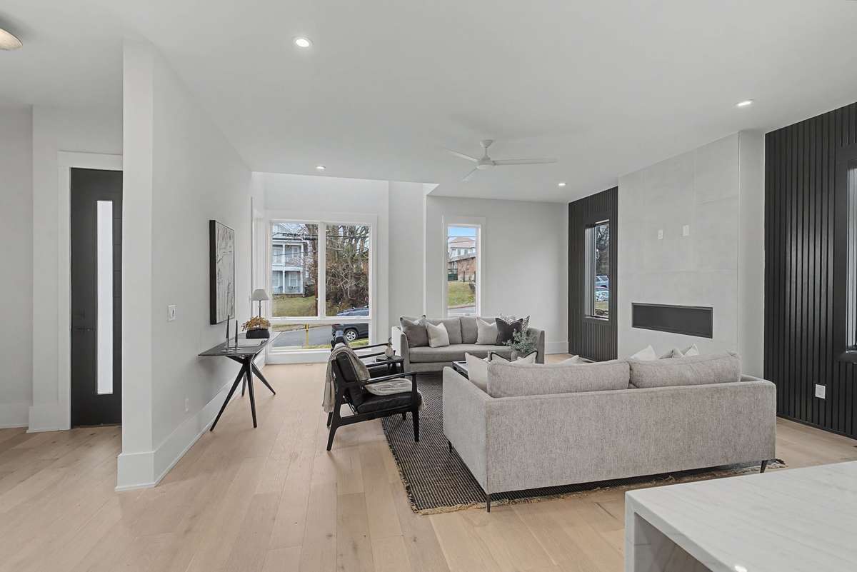Floor to ceiling windows and gas fireplace in main living area.  10ft ceilings!