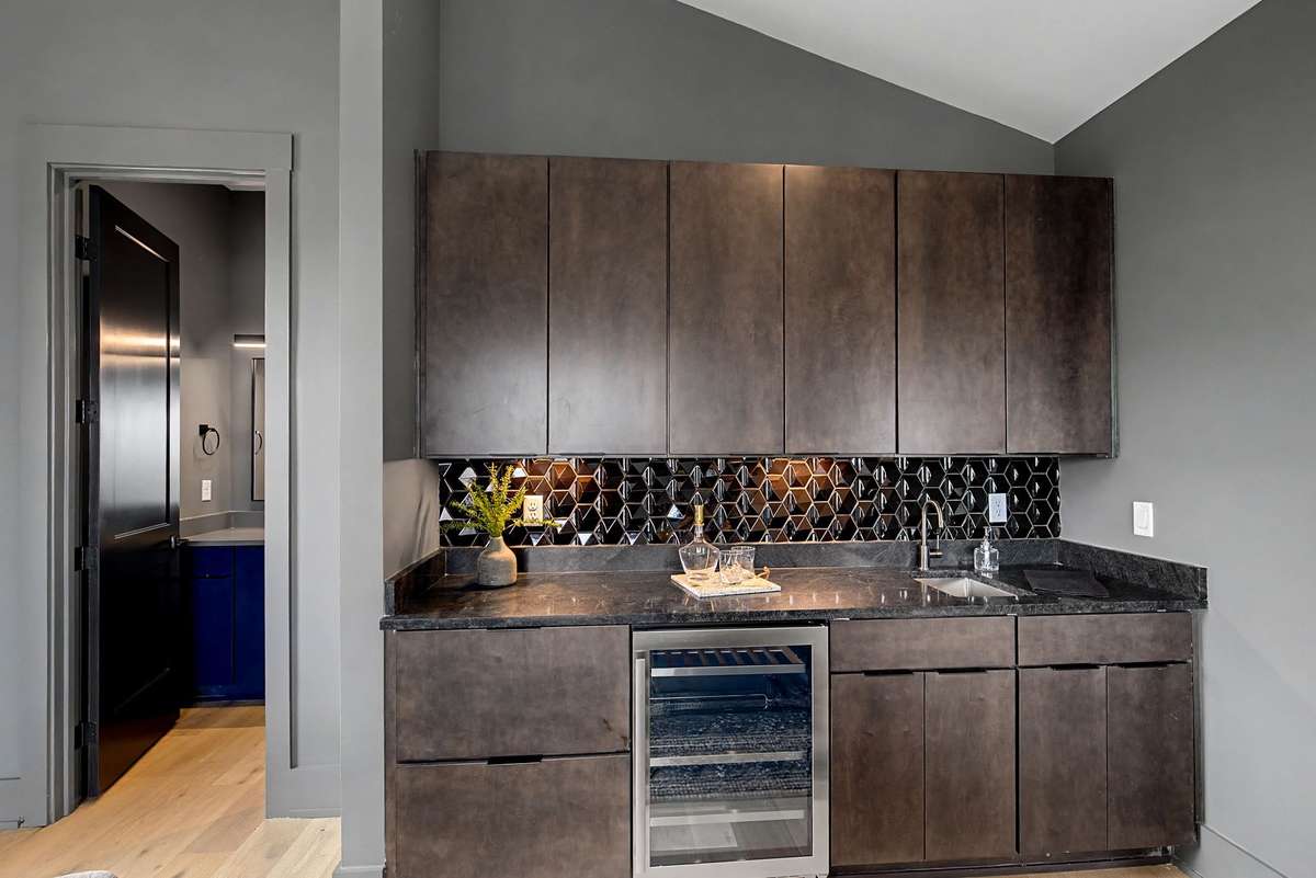 Wet bar and half bath in the bonus room.