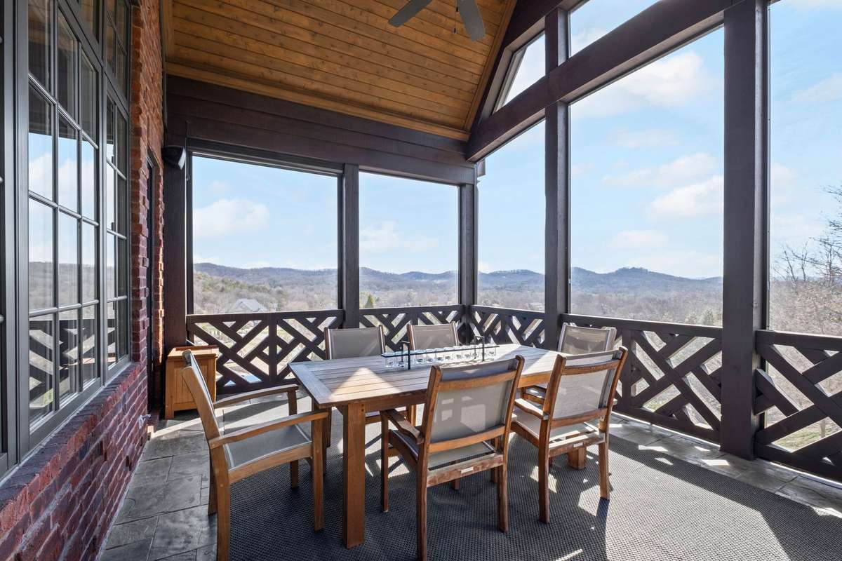The perfect blend of indoor comfort and outdoor beauty- this serene space offers breathtaking views and a relaxing spot to unwind year-round.