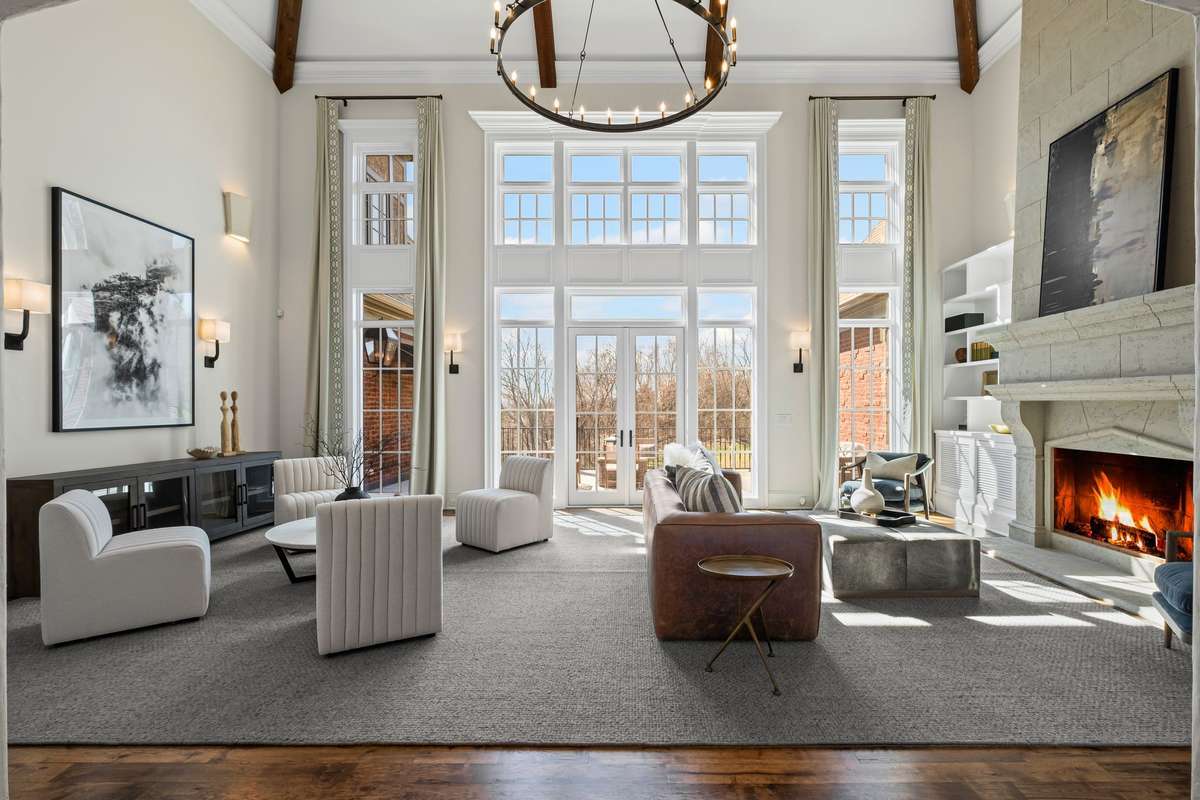 Flooded with natural light, this stunning space showcases floor-to-ceiling windows that frame breathtaking Williamson County views.