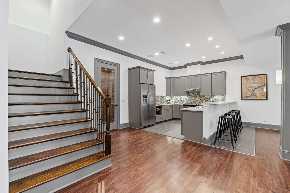 Basement-level living space includes its own full kitchen.