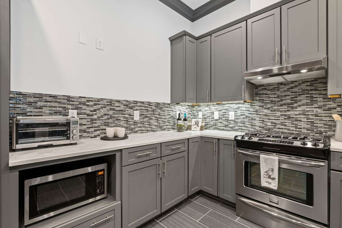Basement-level living space includes its own full kitchen.