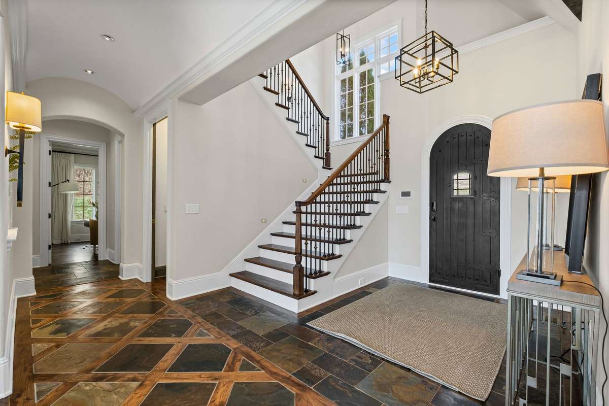 A grand inviting entrance with elegant details, setting the tone for warmth and sophistication within.