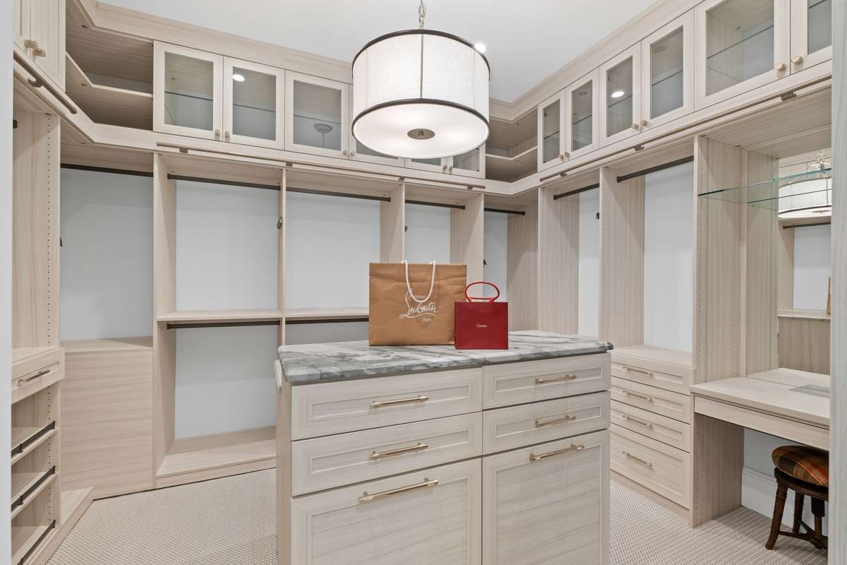 This spacious and well designed closet is perfect for keeping your wardrobe organized an accessible.