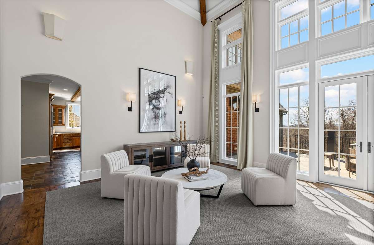 Flooded with natural light, this stunning space showcases floor-to-ceiling windows that frame breathtaking Williamson County views.