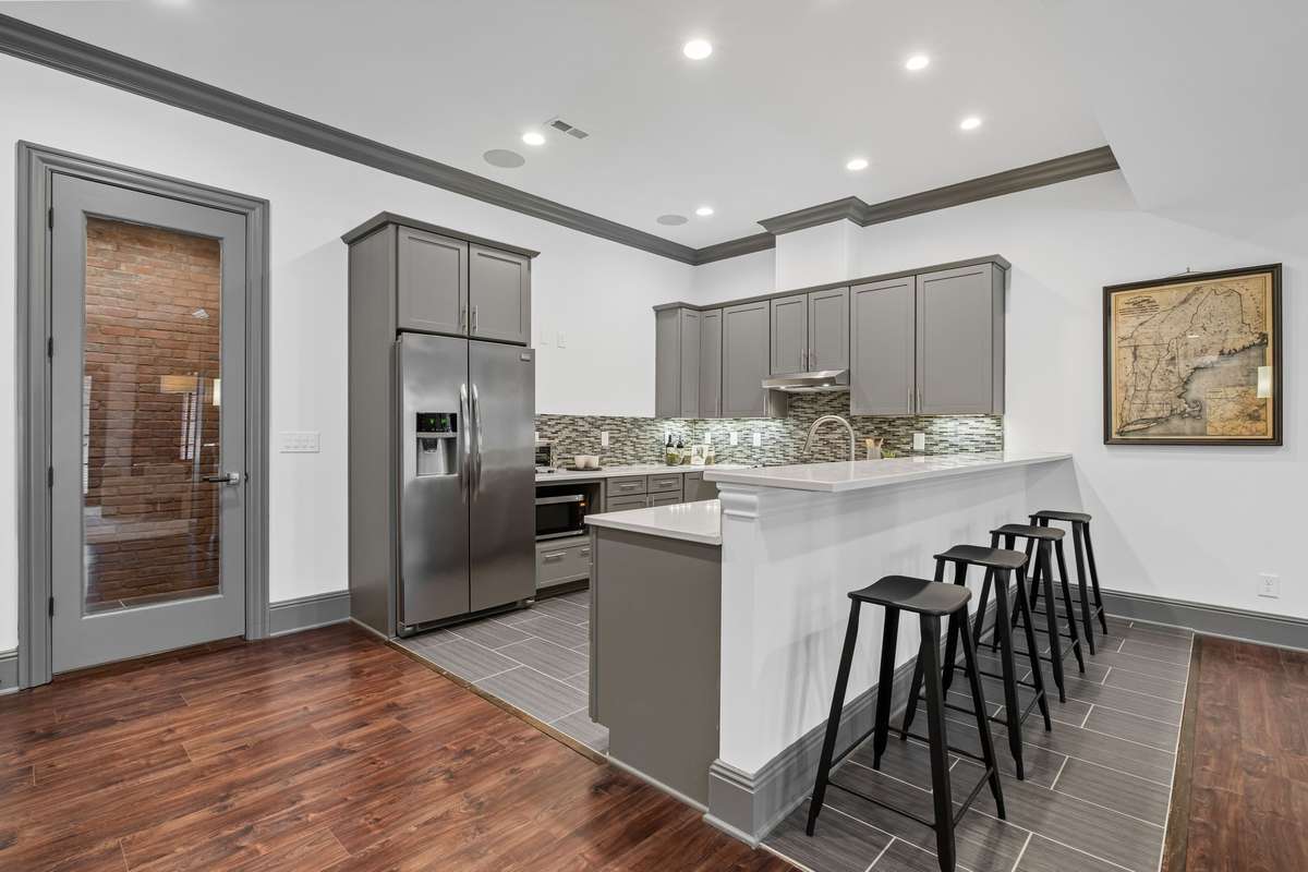 Basement-level living space includes its own full kitchen.