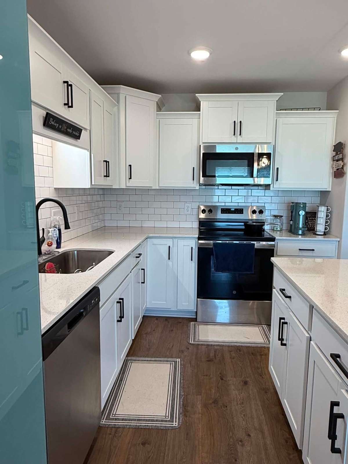 Beautiful soft close cabinets-hardwood flooring-tile backsplash-and tile counter tops-plus stainless appliances to include Refrigerator. Home shows like new condition.