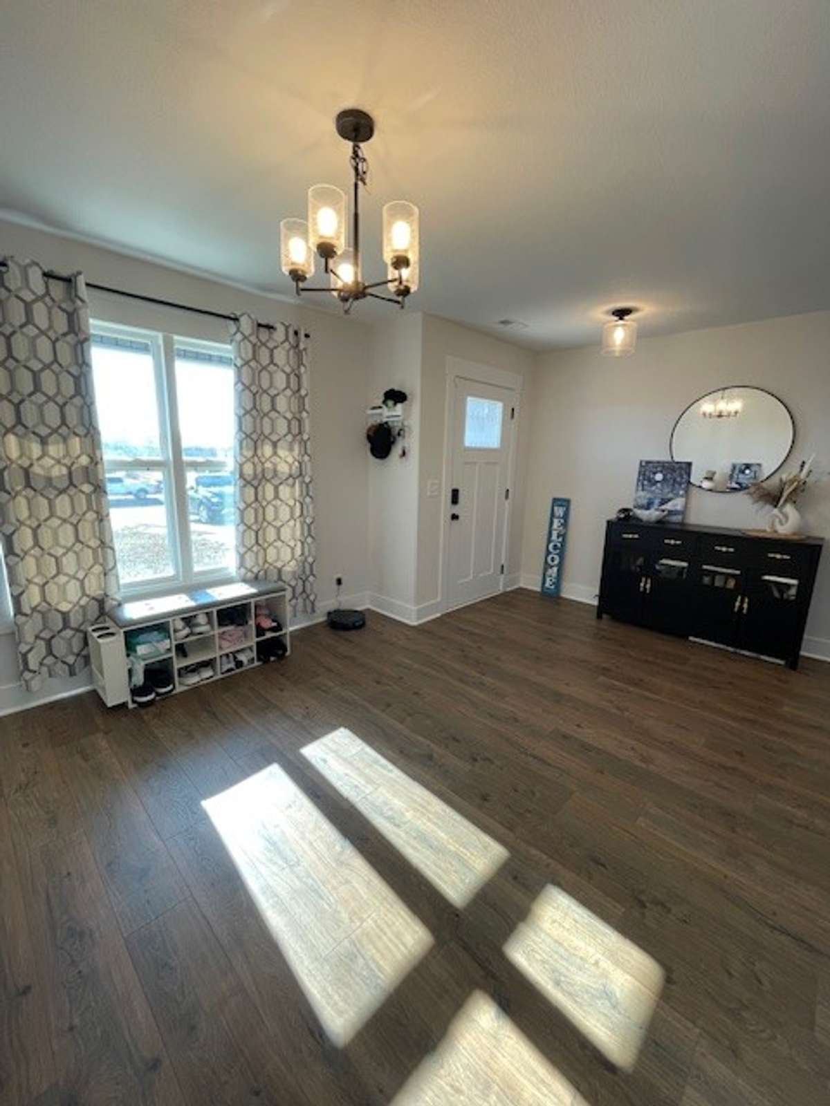 Dining area coming in front door into home