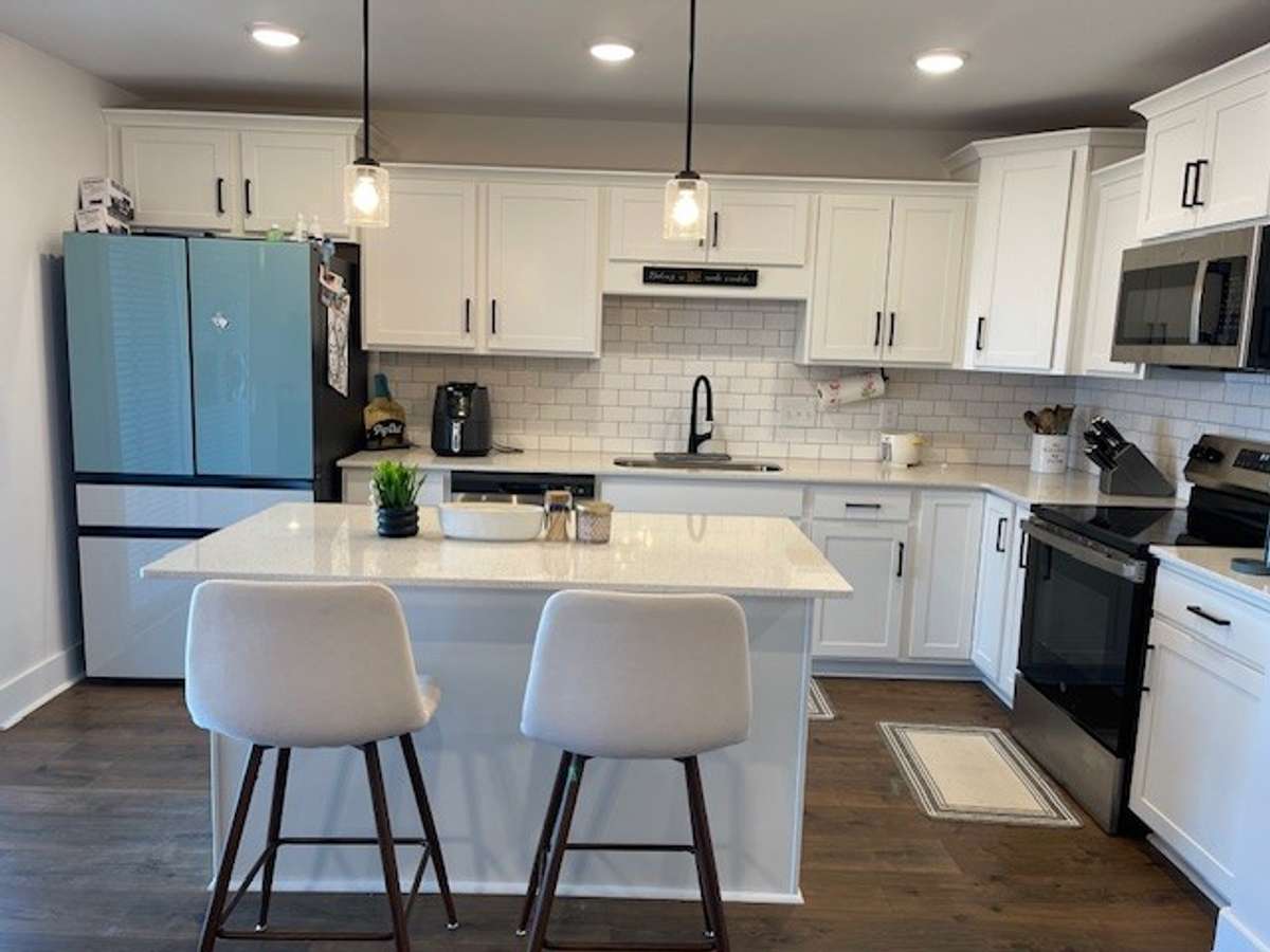 Another view of Kitchen-there are sliding back doors off kitchen leading to covered patio.
