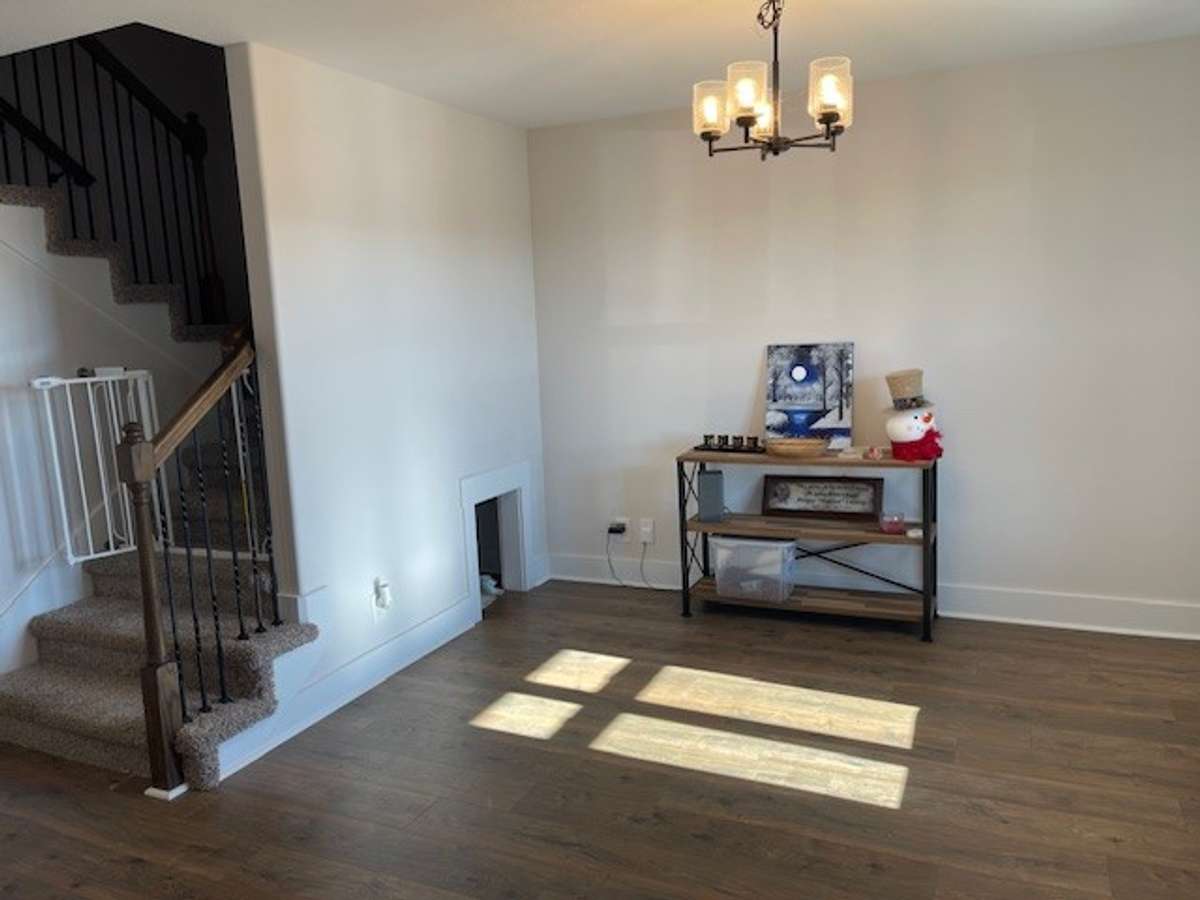 Dining Room shows stairs leading to upper level of home