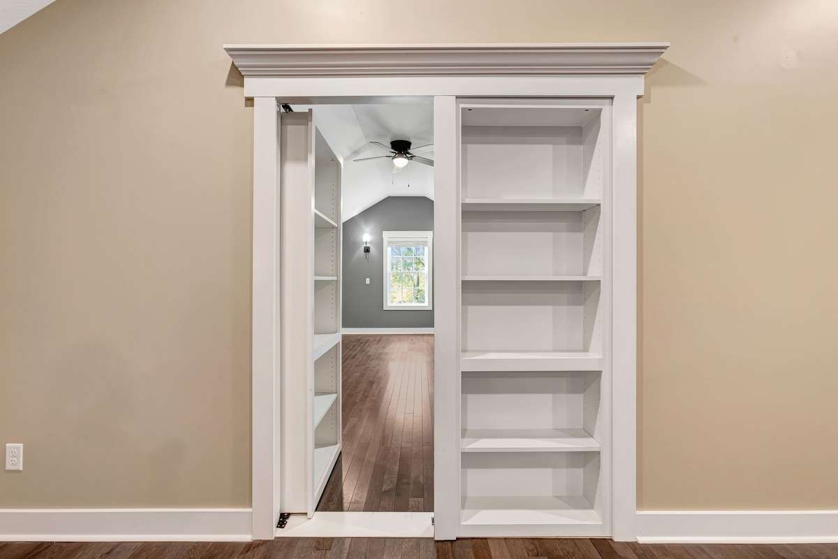 Bedroom/Office/Flex or "Sportsman's Room" featuring a hidden door with built-in bookcase!