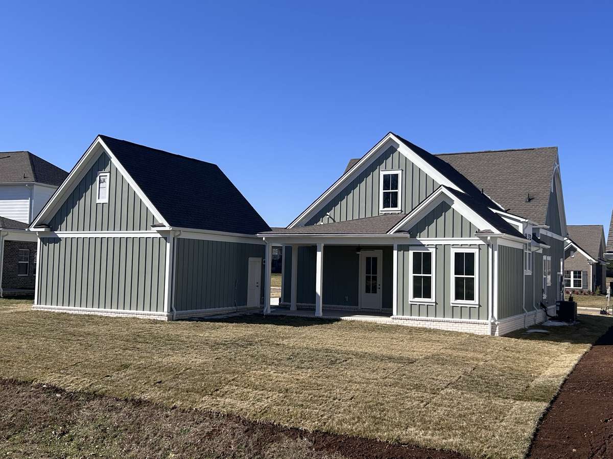 Rear view of the house and its large backyard