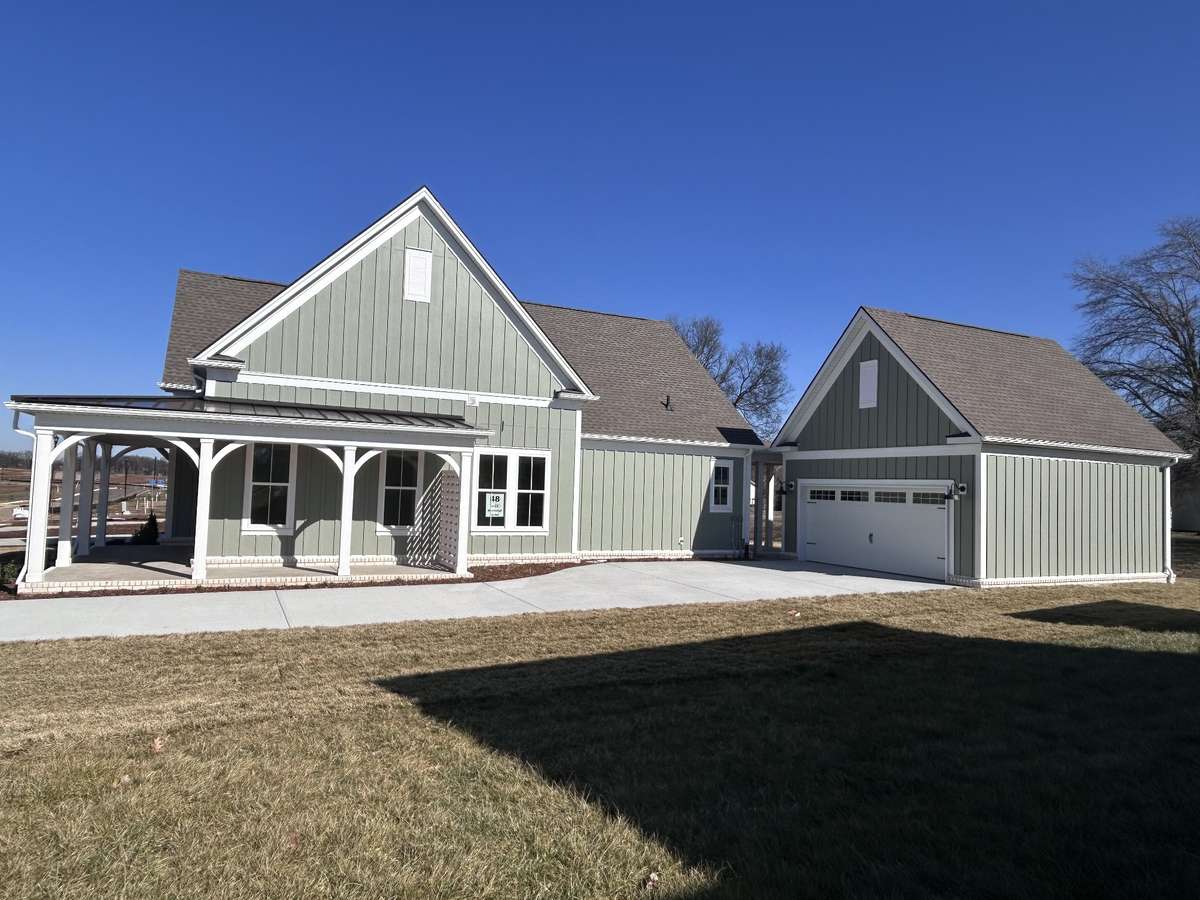 The Sloan has a Fantastic Wrap around poarch with driveway that will accomodate Several cars.
