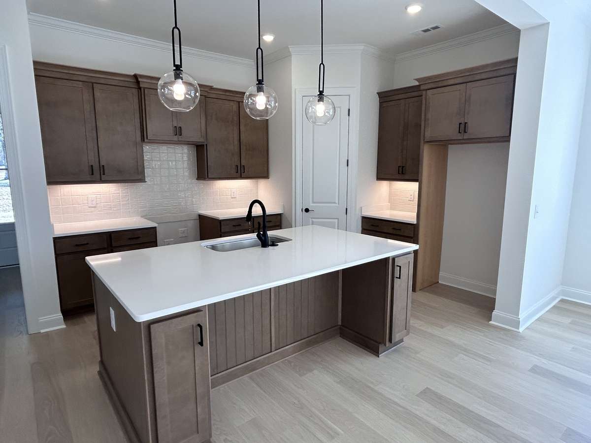 Large kitchen island with loads of storage and this will accomodate 3 or 4 stoold.