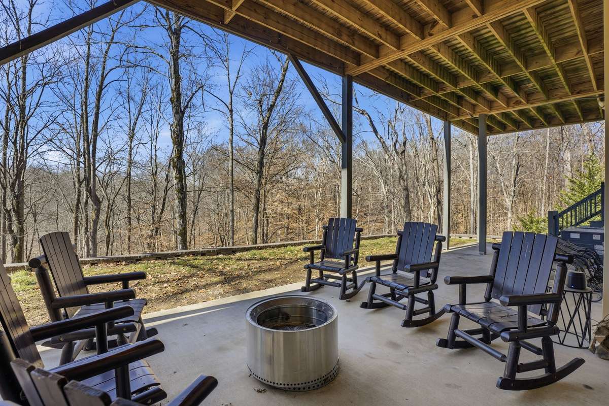 Basement level covered patio area. Pull up a chair, light the firepit, and enjoy family time, or entertain friends for the evening.
