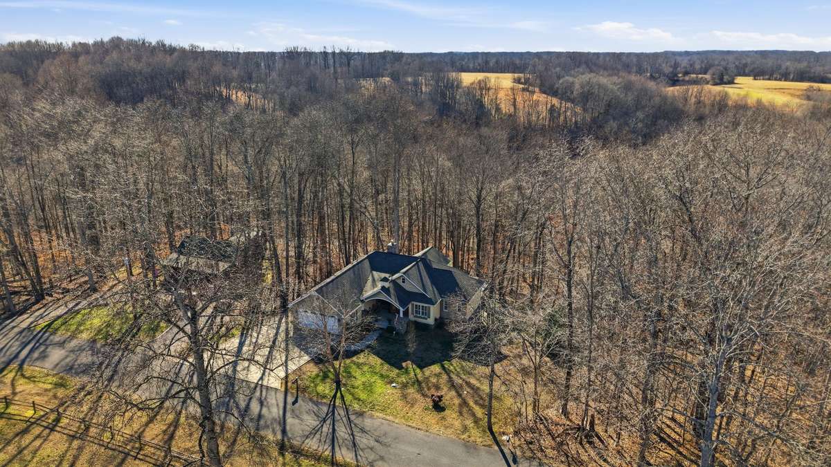 Surrounding woods behind this home is TVA Property offering the ultimate privacy!