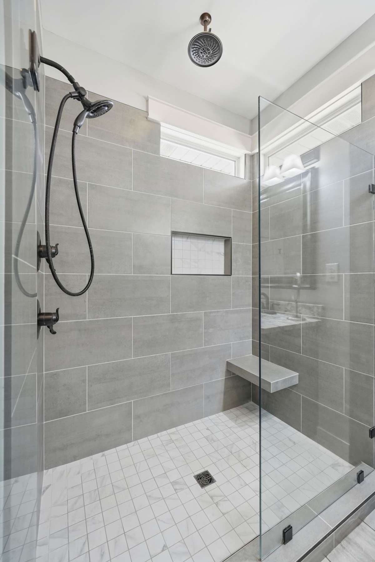 Walk in tiled shower, primary suite