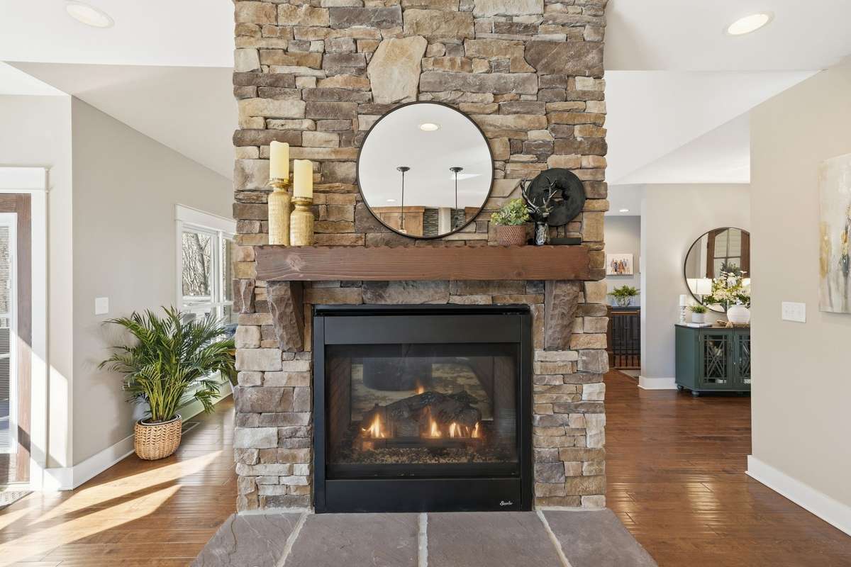 Double sided fireplace- open to kitchen and living room, both.
