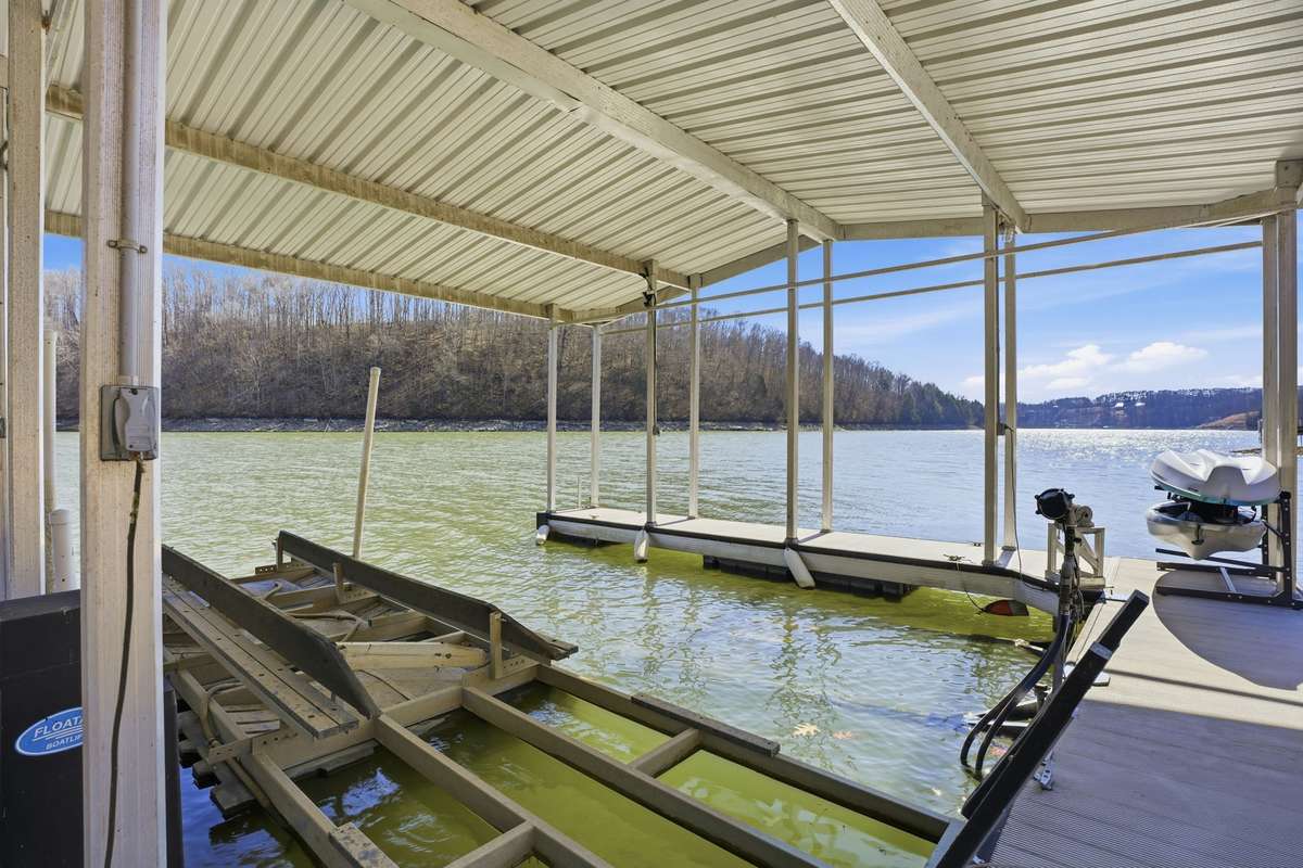 Boat slip with a lift, Slip #1 conveys with the home. Community Dock