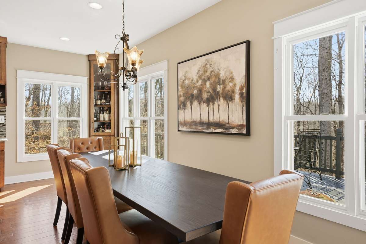Custom dining room table and chairs remain with home.