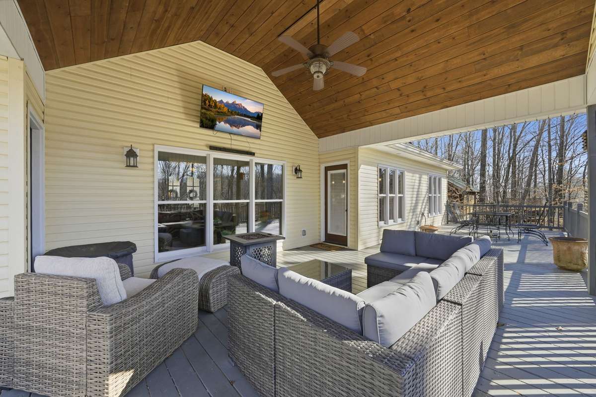 This outdoor space makes for a perfect place to wind down after a fun lake day. Gather with friends and enjoy summer nights, watch fall football games, or the winter Olympics too! Outdoor living at it's best!