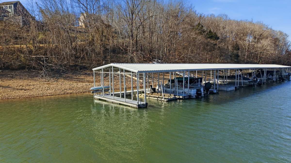 Community Dock. Boat Slip #1 will convey with home. Boat slip does have a lift. Year round water access!