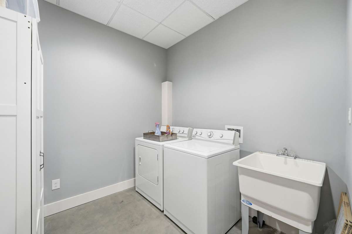 Basement level Laundry room, 2nd Utility in this home. Perfect for guests!