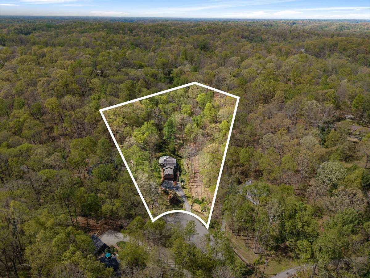 Nestled on a cul-de-sac, these 2 wooded acres provide the perfect blend of privacy and natural beauty.