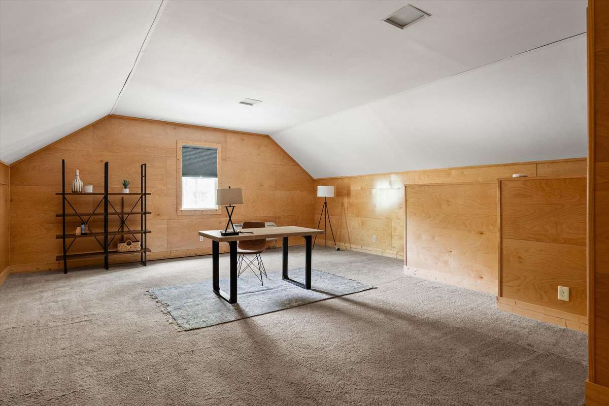 A fantastic bonus room over the garage—perfect as a private work-from-home office or flexible living space.