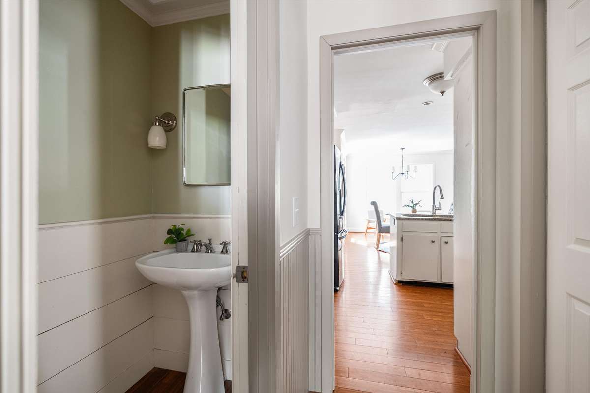 Downstairs powder room in the front entry hallway.
