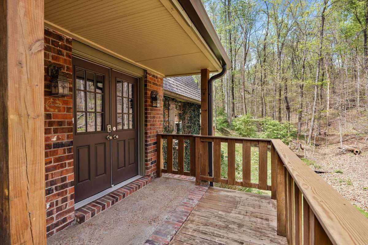 Double door entry with decking overlook to enjoy the beauty of nature.