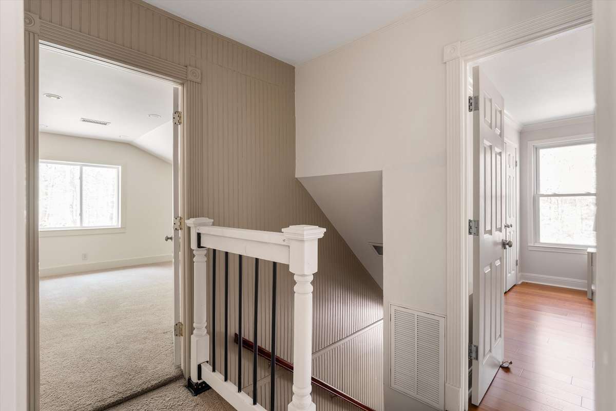 Upstairs, you’ll find a versatile bonus space, two oversized bedrooms, and a stunning updated bathroom connecting both.
