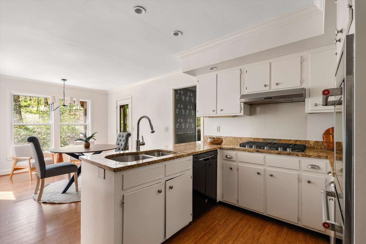 A bright, functional kitchen with plenty of space to gather, offering the perfect opportunity to make it your own.