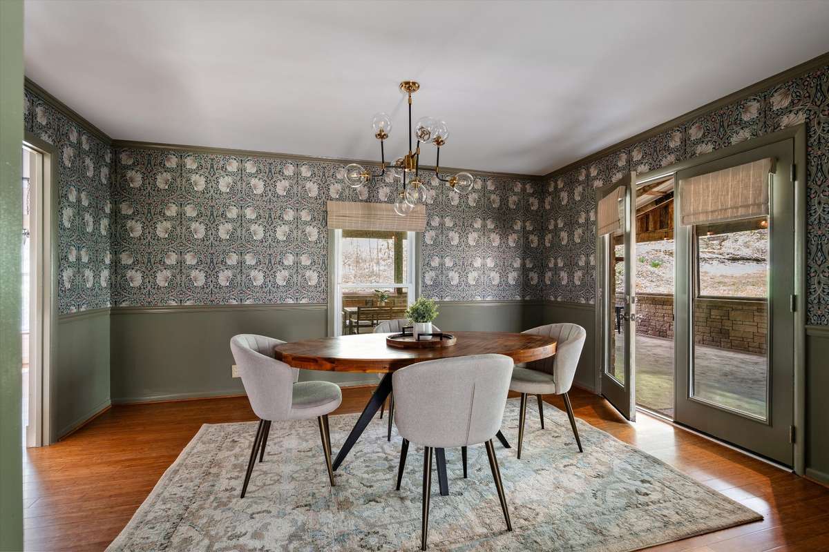 Gather around the table in this beautifully styled dining room, then step right outside to enjoy the outdoor living space.
