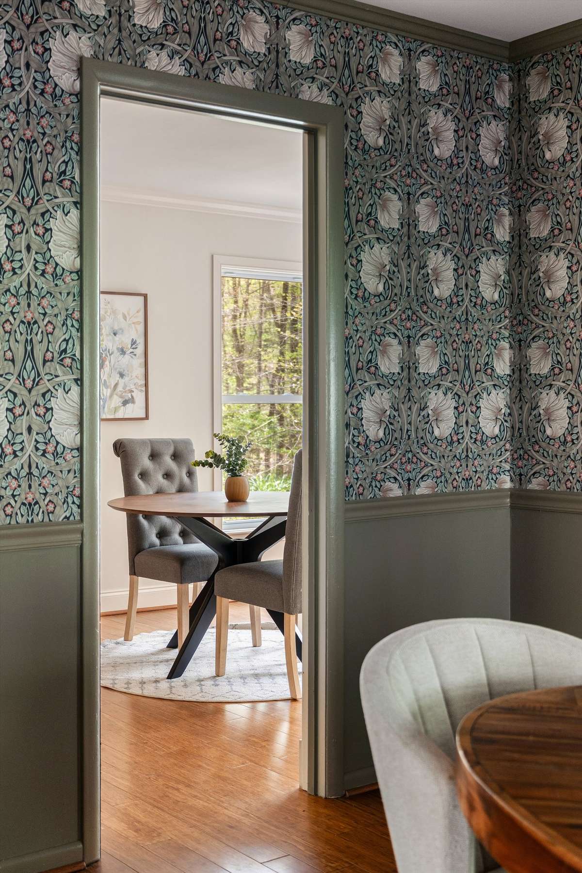 A peak into the kitchen breakfast nook from the dining room.