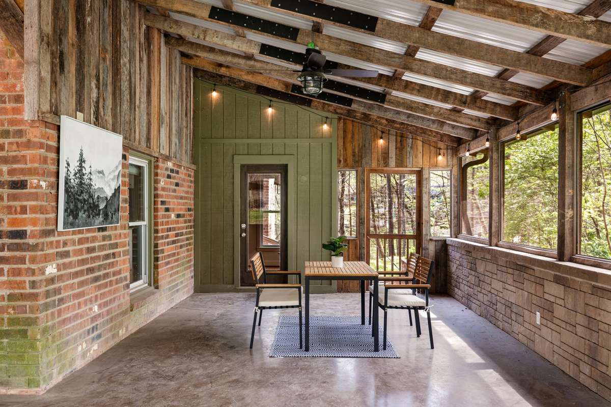 Gather around the table and enjoy dining immersed in nature, with stunning wooded views in every direction.