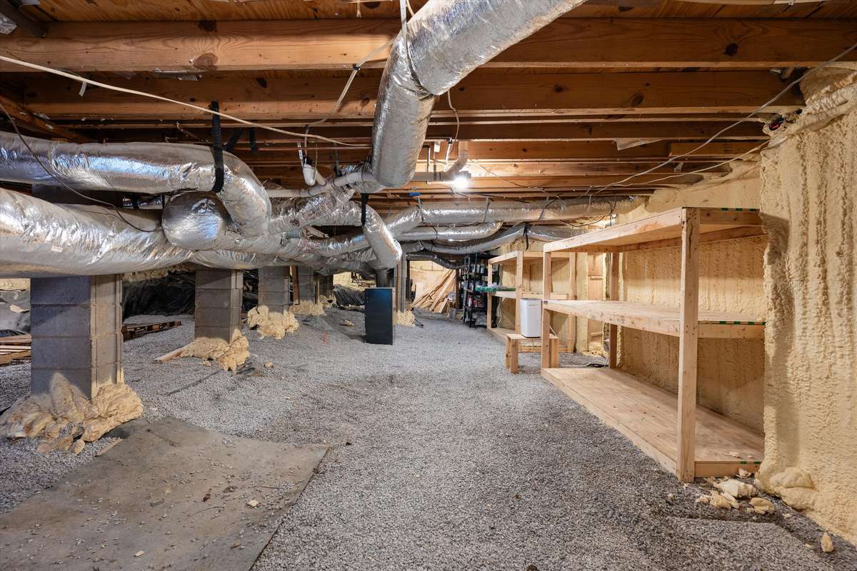 Walk in crawl space with amazing storage opportunities.