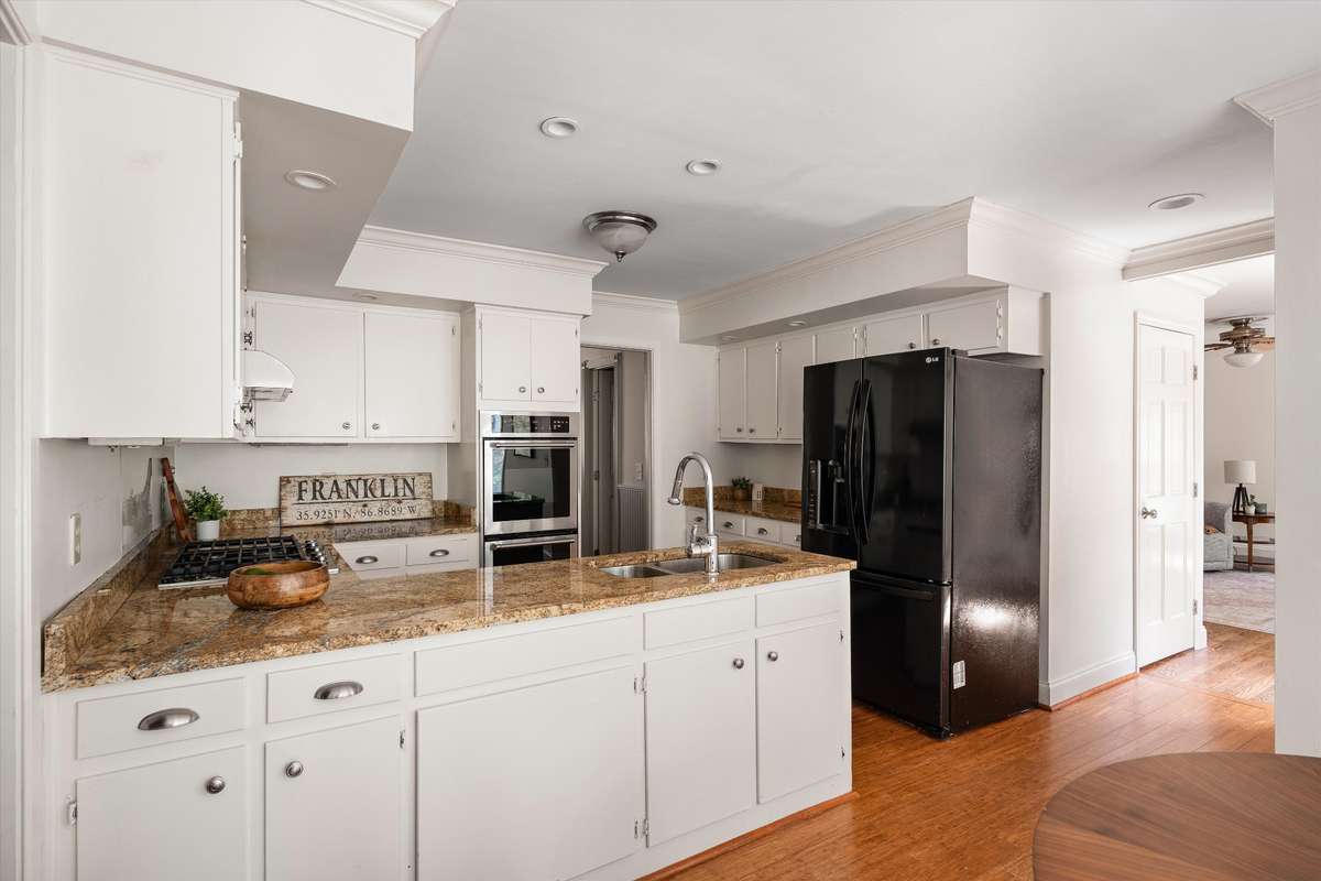 A spacious kitchen with great flow and natural light—ready for your personal touch.