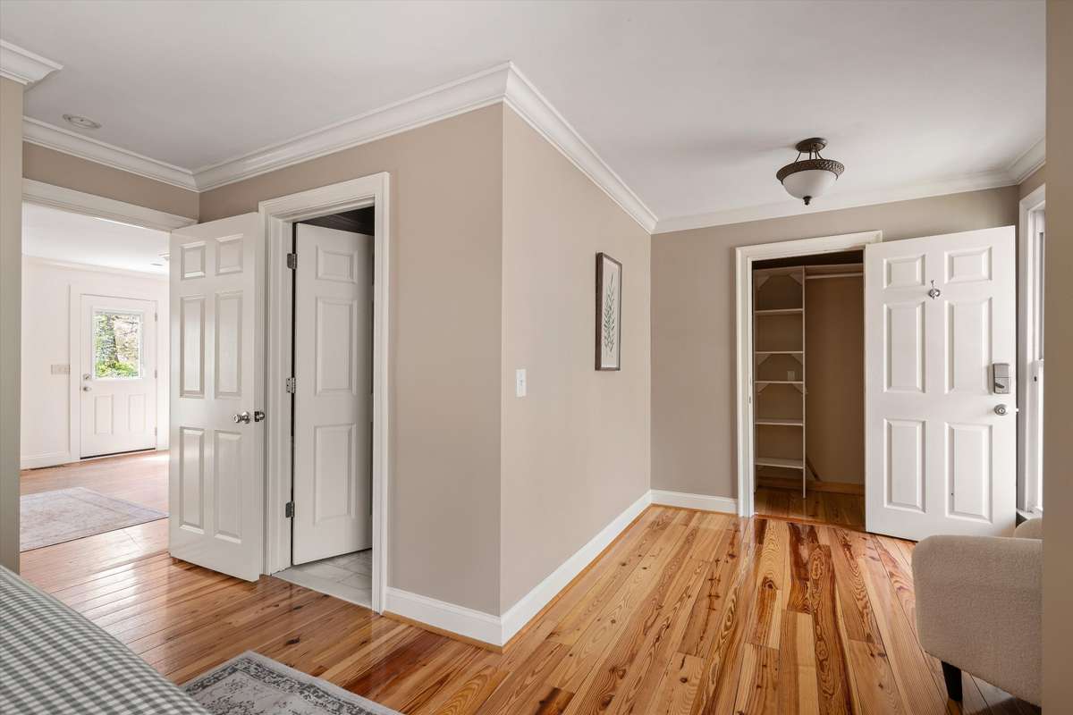 Relax and unwind in the main-floor primary suite, complete with a large closet, inviting sitting area, and private bath.