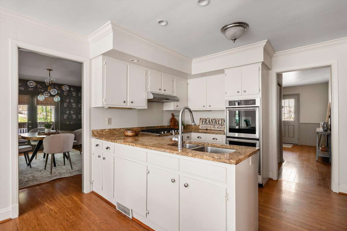 A spacious kitchen with great flow and natural light—ready for your personal touch.