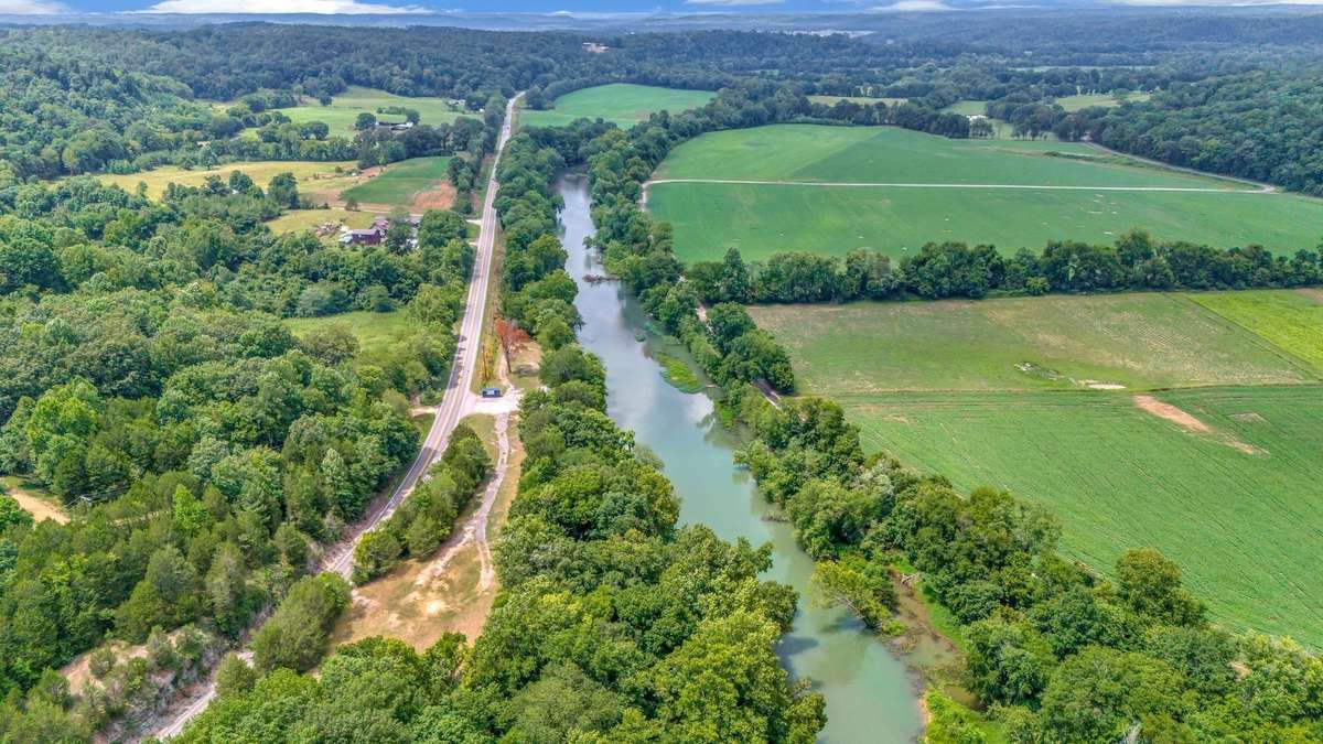 Property is in 3 Tracts and  2 Tax Parcels, totaling 6.95 acres+/- per Seller.