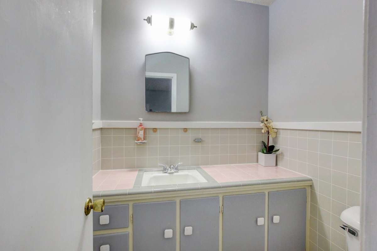 Half bathroom in primary bedroom